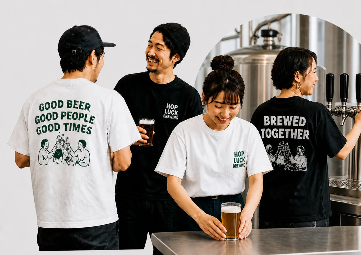 ステンレスタンクとビールサーバーの前でプリントTシャツを着たブルワリーチーム